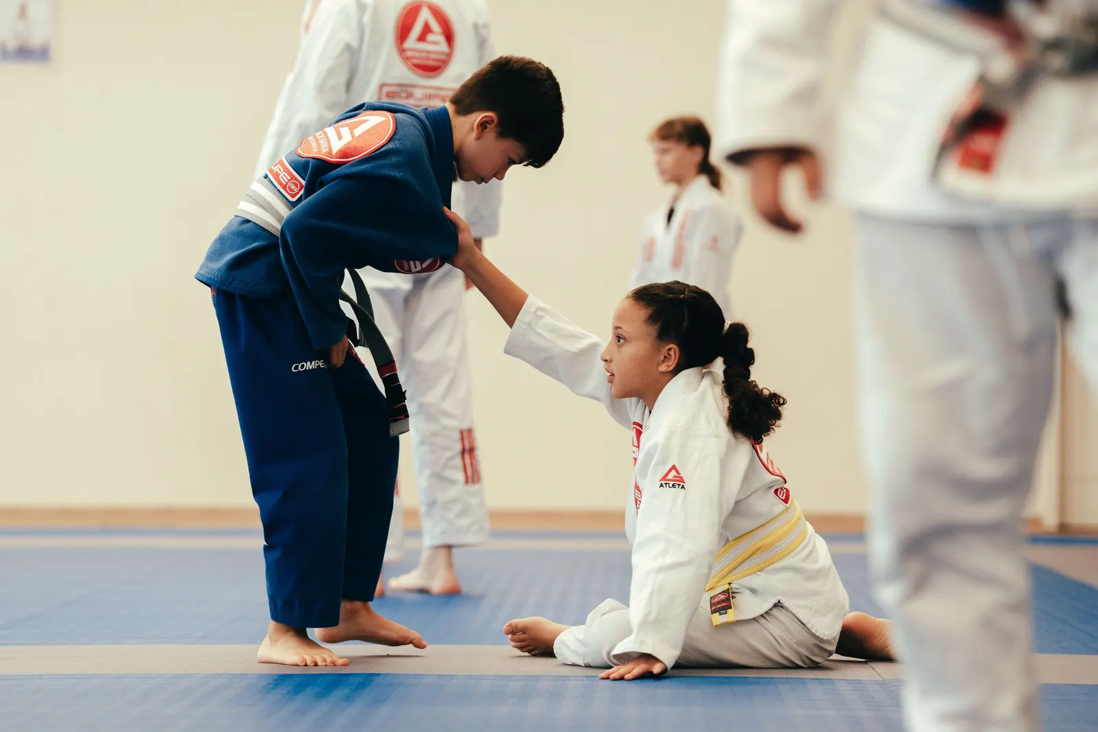 Children practising a Jiu-Jitsu technique together