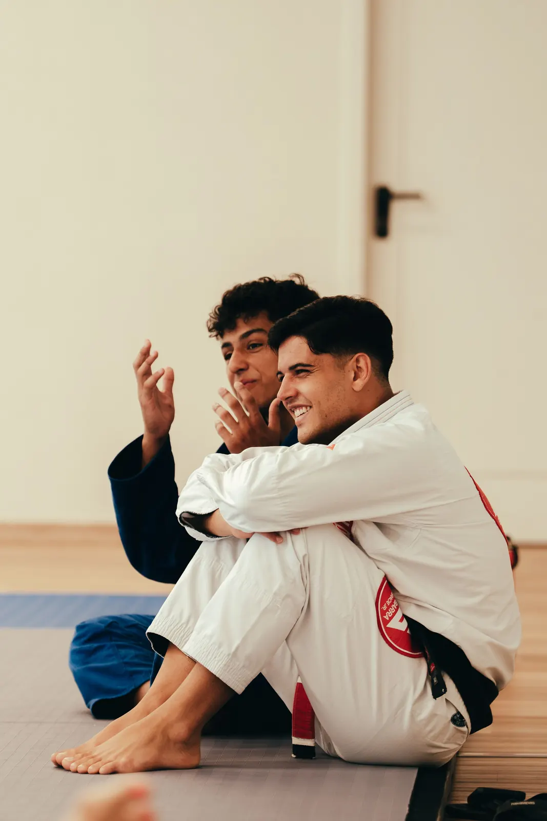 Two adult students in gis sitting and talking